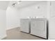 Clean laundry room with white washer and dryer units at 3739 W 46Th Ave, Denver, CO 80211