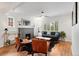 Bright living room showcasing a decorative fireplace, hardwood floors, and comfortable seating at 3739 W 46Th Ave, Denver, CO 80211