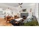 Stylish living room features a cozy fireplace, hardwood floors, and modern furnishings at 3739 W 46Th Ave, Denver, CO 80211