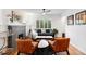 Inviting living room with a charming fireplace, hardwood floors, and plenty of natural light at 3739 W 46Th Ave, Denver, CO 80211