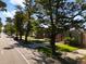 Beautiful tree-lined street with well-maintained lawns and sidewalks, creating a picturesque neighborhood scene at 3739 W 46Th Ave, Denver, CO 80211