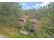 Aerial shot of a home featuring a fenced patio and lush green surroundings at 2378 Hearth Dr # 20, Evergreen, CO 80439