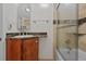Updated bathroom with granite countertops, modern fixtures, and a glass-enclosed shower at 2378 Hearth Dr # 20, Evergreen, CO 80439