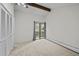 Large bedroom with plush carpeting, great natural light, and closet storage at 2378 Hearth Dr # 20, Evergreen, CO 80439