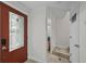 Tiled entryway leads to open-concept living area at 2378 Hearth Dr # 20, Evergreen, CO 80439