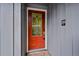 Red front door with decorative glass and silver fixtures at 2378 Hearth Dr # 20, Evergreen, CO 80439