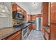 Modern kitchen with stainless steel appliances, stone countertops, and ample cabinet space at 2378 Hearth Dr # 20, Evergreen, CO 80439