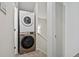 Stacked laundry machines in a compact laundry area, conveniently located inside the home at 2378 Hearth Dr # 20, Evergreen, CO 80439