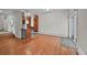 Spacious living room featuring hardwood floors and a modern design with a sliding glass door for natural light at 2378 Hearth Dr # 20, Evergreen, CO 80439