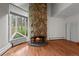 Living room shows beautiful stone fireplace at 2378 Hearth Dr # 20, Evergreen, CO 80439