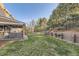 Well-maintained backyard featuring a lush lawn, a spacious patio, and mature trees at 7273 E Hinsdale Pl, Centennial, CO 80112