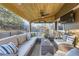 Relaxing covered patio with comfortable seating, a ceiling fan, and an outdoor television at 7273 E Hinsdale Pl, Centennial, CO 80112