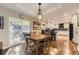 Open-concept dining area leading to a modern kitchen with ample counter space at 7273 E Hinsdale Pl, Centennial, CO 80112