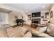 Comfortable living room with a stone fireplace, built-in shelving, and plush seating at 7273 E Hinsdale Pl, Centennial, CO 80112
