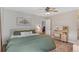 Serene bedroom with neutral tones, an ensuite vanity, and a large comfortable bed at 10810 W Alamo Pl, Littleton, CO 80127