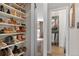 Organized walk-in closet with built-in shelving, maximizing storage space at 10810 W Alamo Pl, Littleton, CO 80127