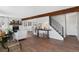 Inviting living room with open floor plan, a fireplace, wooden beam, and stylish decor at 10810 W Alamo Pl, Littleton, CO 80127