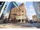 Exterior shot of building in a city setting with crosswalk and traffic lights at 444 17Th St # 208, Denver, CO 80202