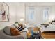 Cozy living room with stylish decor, hardwood floors, and bright natural light at 444 17Th St # 208, Denver, CO 80202