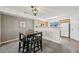 Stylish dining area with a four-person table and view of the adjacent kitchen at 9770 Dahlia Ln, Thornton, CO 80229