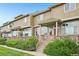 Inviting townhome exteriors boast covered front porches, manicured landscaping, and a warm, welcoming atmosphere at 9770 Dahlia Ln, Thornton, CO 80229