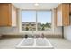 Kitchen sink view showcasing the neighborhood and green surroundings at 9770 Dahlia Ln, Thornton, CO 80229