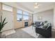 Inviting living room with fireplace, ample natural light, and comfortable seating at 9770 Dahlia Ln, Thornton, CO 80229