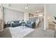Cozy living room with modern furnishings and an open staircase to the second floor at 9770 Dahlia Ln, Thornton, CO 80229