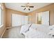 Bright main bedroom features three closets, including one walk-in, plus neutral carpet at 9770 Dahlia Ln, Thornton, CO 80229