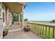 Spacious covered porch with decorative planters and a view of a baseball field at 9770 Dahlia Ln, Thornton, CO 80229