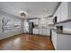 Bright kitchen with white cabinets and stainless steel appliances at 9442 E 106Th Dr, Commerce City, CO 80640