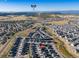 Wide aerial shot of a residential community in Colorado with mountain views in the background on a clear day at 4851 Cattle Cross Rd, Castle Rock, CO 80104