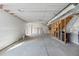Large unfinished basement with framed stairwell and walls, and utility connections visible at 4851 Cattle Cross Rd, Castle Rock, CO 80104