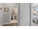 View of a bathroom with modern vanity and toilet, accessible from the hallway at 4851 Cattle Cross Rd, Castle Rock, CO 80104