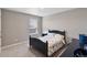 This carpeted bedroom has one window, neutral paint, and essential furniture at 4851 Cattle Cross Rd, Castle Rock, CO 80104