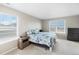 Carpeted bedroom with dual windows providing great light and views, plus dark dresser at 4851 Cattle Cross Rd, Castle Rock, CO 80104