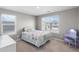 Bright bedroom boasts dual windows offering pleasant views and ample natural light at 4851 Cattle Cross Rd, Castle Rock, CO 80104