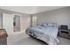 Comfortable bedroom with a large window and access to the rest of the home at 4851 Cattle Cross Rd, Castle Rock, CO 80104