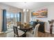 Cozy dining area with a round table and sliding glass door to an outdoor deck at 4851 Cattle Cross Rd, Castle Rock, CO 80104