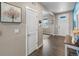 Inviting entryway with wood floors and neutral walls, leading to a bright and airy living space at 4851 Cattle Cross Rd, Castle Rock, CO 80104