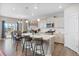 Modern kitchen featuring gray cabinets, a center island with bar seating, and stainless steel appliances at 4851 Cattle Cross Rd, Castle Rock, CO 80104