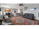 Open living space with kitchen, dining area, and comfortable seating, and an area rug at 4851 Cattle Cross Rd, Castle Rock, CO 80104