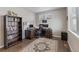 Comfortable home office featuring hardwood floors, a bookshelf, and a functional workspace at 4851 Cattle Cross Rd, Castle Rock, CO 80104