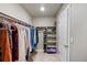 Walk-in closet features ample shelving and hanging storage for clothing and shoes at 4851 Cattle Cross Rd, Castle Rock, CO 80104