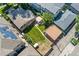 Aerial view of a well-maintained backyard, mature trees and the neighborhood surrounding the property at 521 Harrison St, Denver, CO 80206