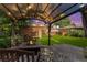 Backyard with a gazebo, fire pit, brick wall and fence for privacy and relaxation at 521 Harrison St, Denver, CO 80206