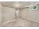A blank canvas basement space with carpet and a window for natural light at 521 Harrison St, Denver, CO 80206