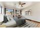 Bright bedroom with a ceiling fan and multiple windows offering natural light at 521 Harrison St, Denver, CO 80206