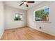 Light-filled bedroom featuring hardwood floors and bright windows at 521 Harrison St, Denver, CO 80206