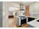 Bright kitchen showcases a modern range and views into the dining area at 521 Harrison St, Denver, CO 80206
